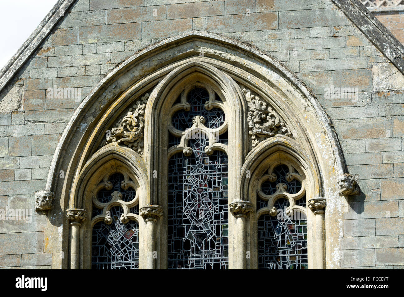 Exterior view of the east window, St. Michael`s Church, Haselbech, Northamptonshire, England, UK Stock Photo